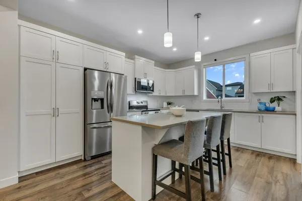 Bright white kitchen with island seating